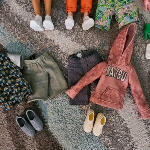 4 Barbie dolls and outfits